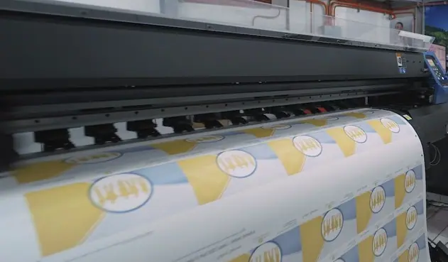 Wide format printer printing roll media