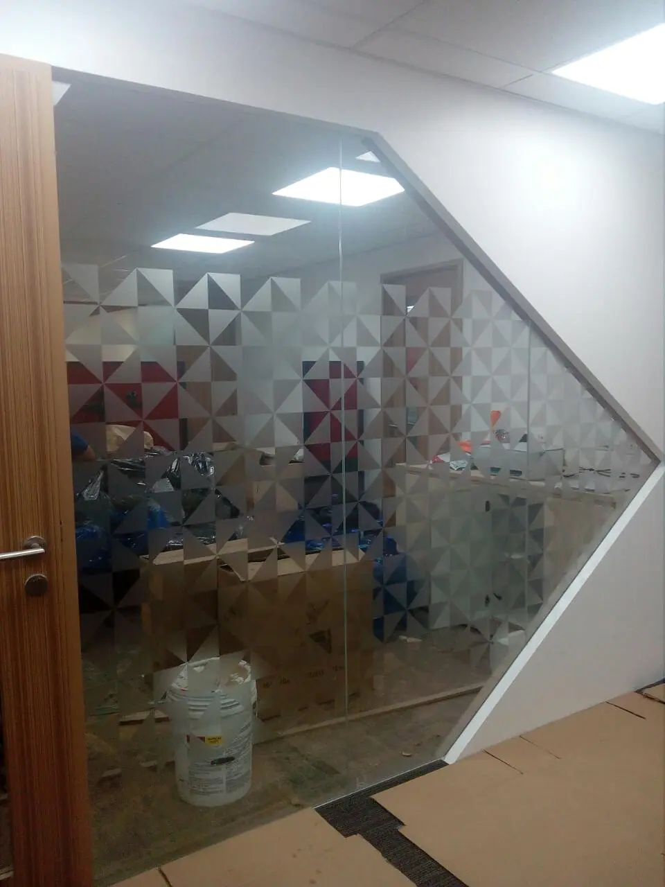Geometric frosted film on a glass meeting room