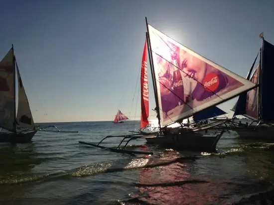 Paraw sailboats with printed sails at sea