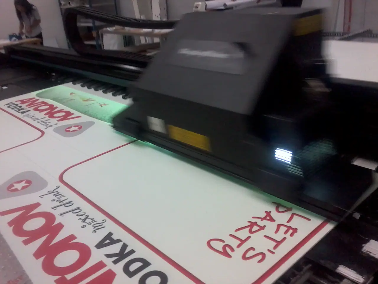 Rigid display board being printed on a flatbed printer