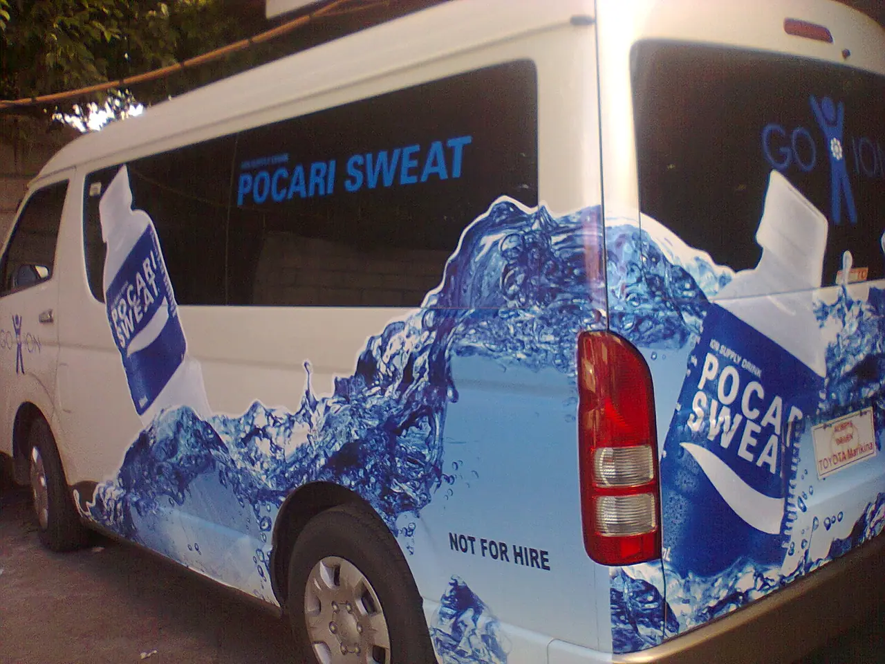 Rear view of a beverage brand van wrap
