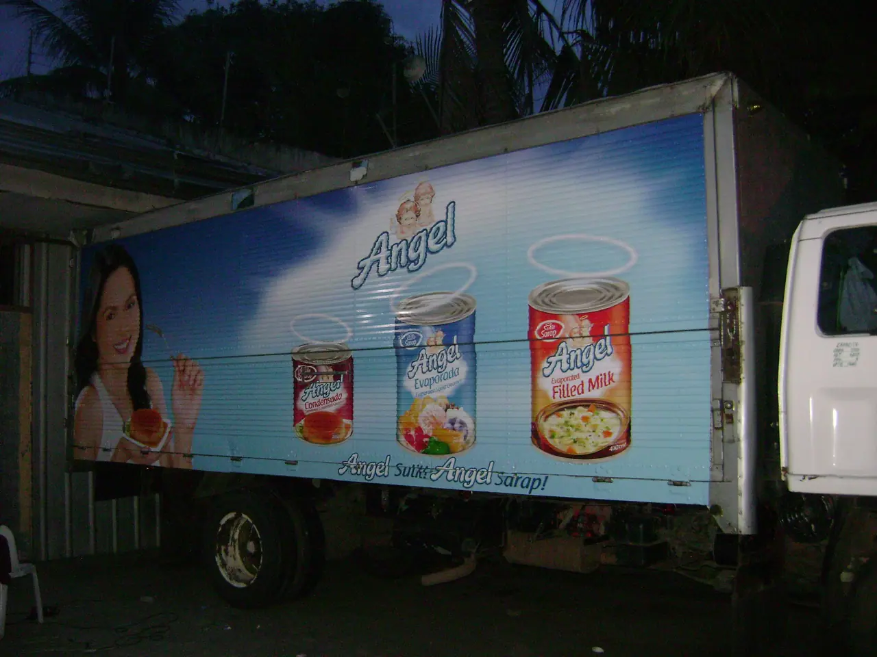 Product advertising graphics along a truck body