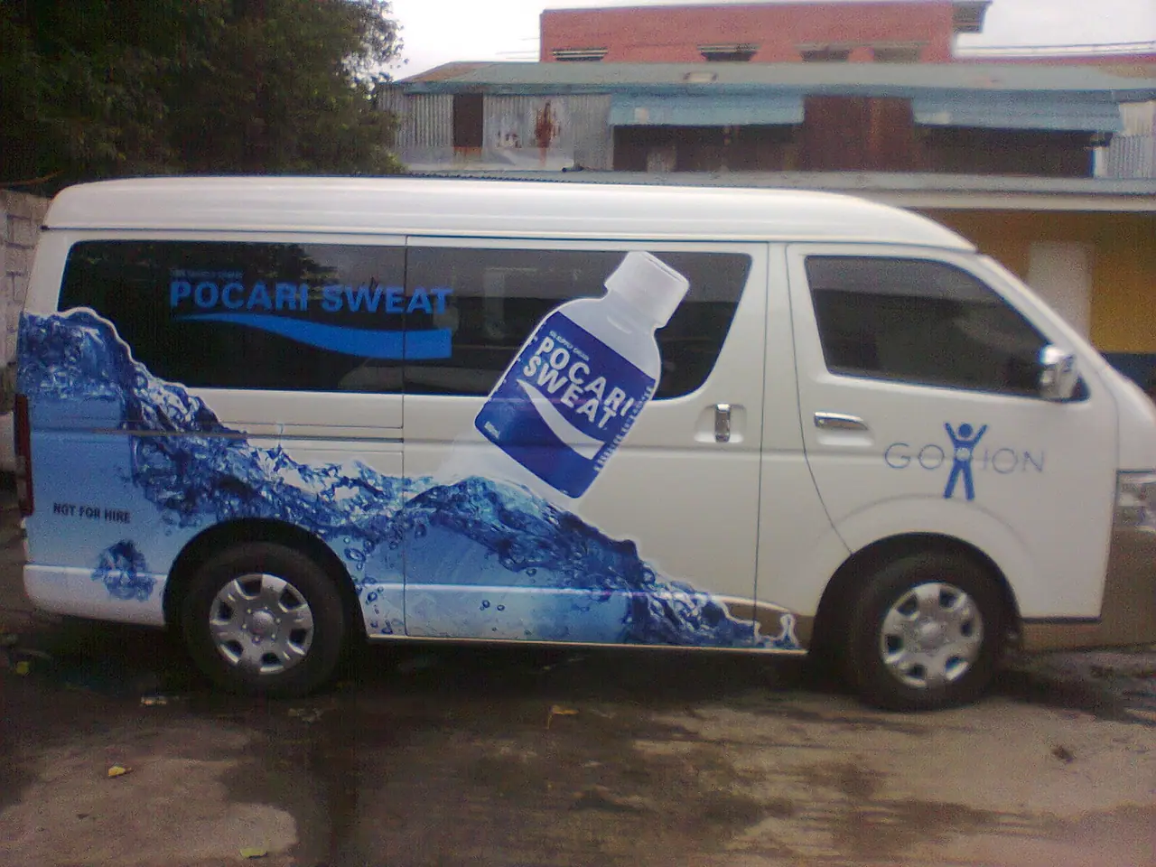 Beverage brand wrap on a passenger van