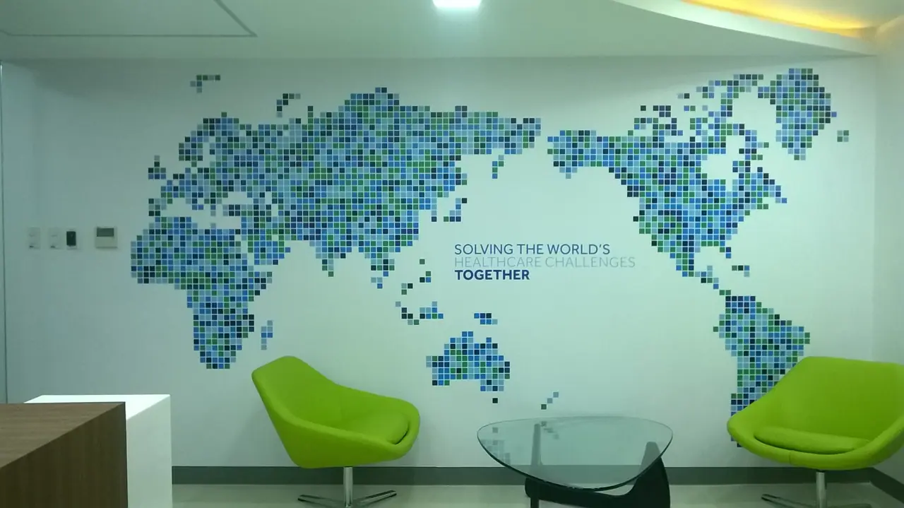 World map wall graphic in an office breakout area