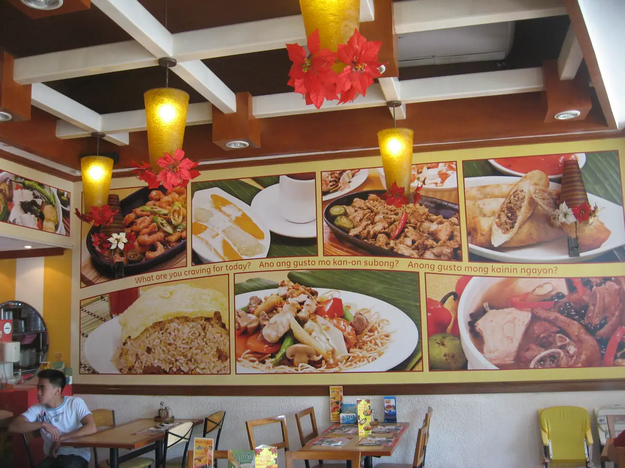Food photography mural running along a restaurant wall